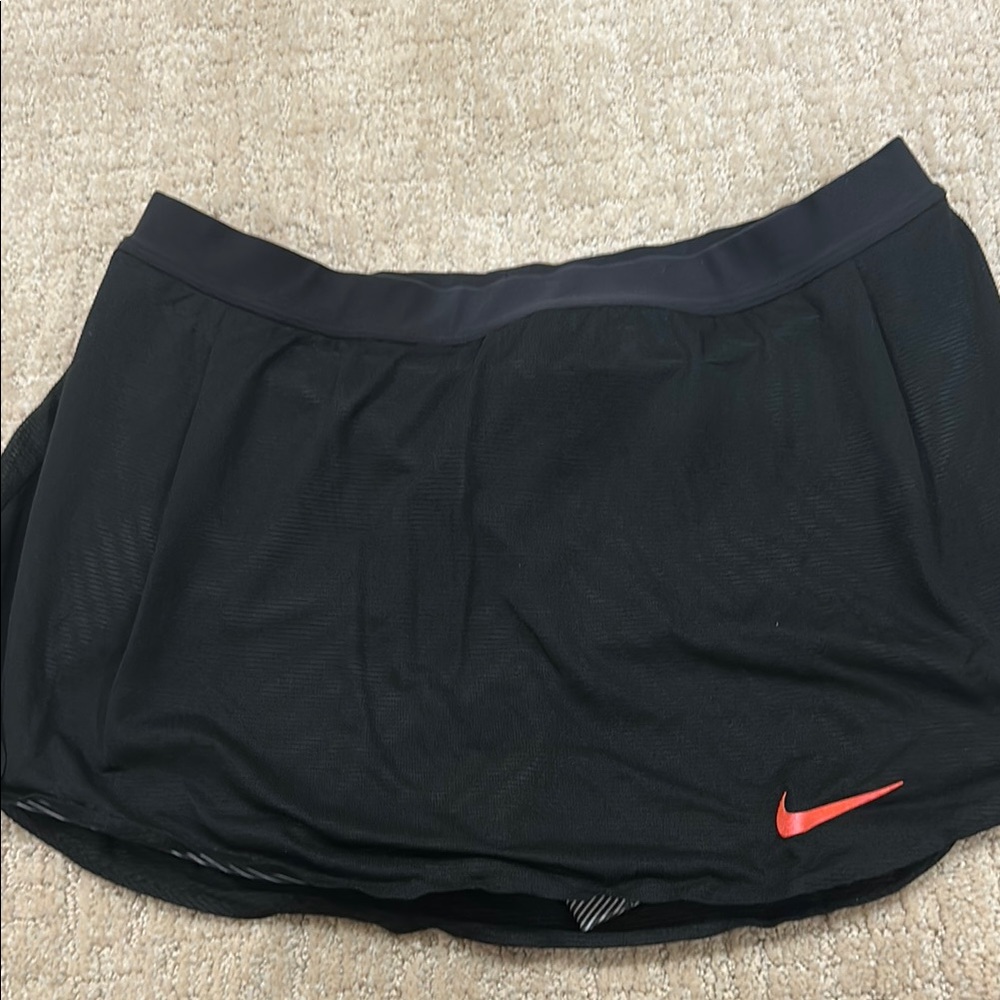 Nike Black Skort with black and white built in shorts in size medium